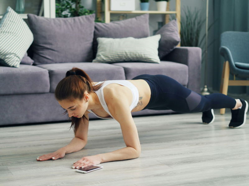 Home workout space with exercises like planks.
