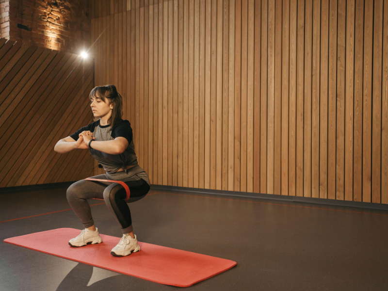 Using a resistance band at home to stay active during the day