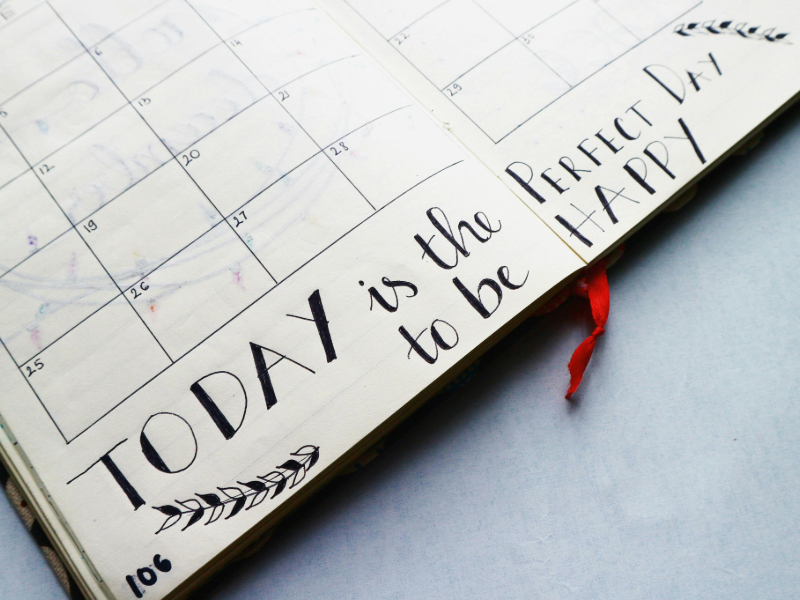  Beginner marking a consistent workout routine on a calendar