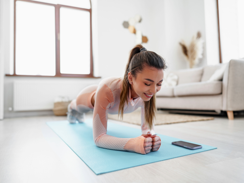Beginner holding a proper plank position as a bodyweight exercise