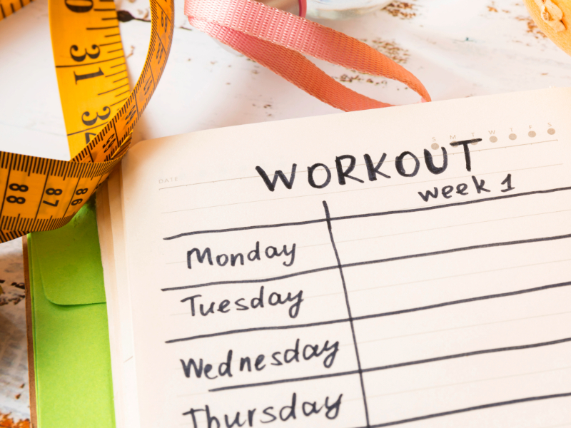 Weekly workout plan for beginners written in a fitness planner