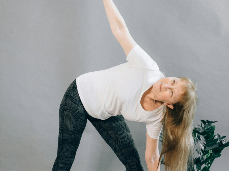 Fitness for beginners over 50 doing home stretching exercises